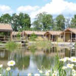 Alfsee Ferien und Erholungspark Germanendorf vom Campingplatz mit Terassen am See  150x150