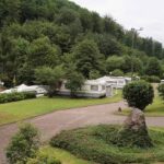 Camping Clausensee Wohnmobilstellplatz vom Campingplatz im Gruenen mit Blick auf gruene Huegel 150x150