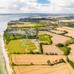 Ostseecamping Familie Heide Vogelperspektive auf den Campingplatz die Kueste mit Strand und die umliegenden Felder 0782d158 533e 4915 863f 8d698b6e1092 150x150