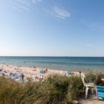 Regenbogen Nonnevitz Badestrand mit Gaeste beim Campingplatz 150x150