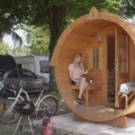 Strandcamping Waging Campingfass im Schatten unter Baeumen auf dem Campingplatz bei Muenchen 150x150