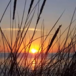 Camping Fluegger Strand Sonnenuntergang auf dem Meer  150x150